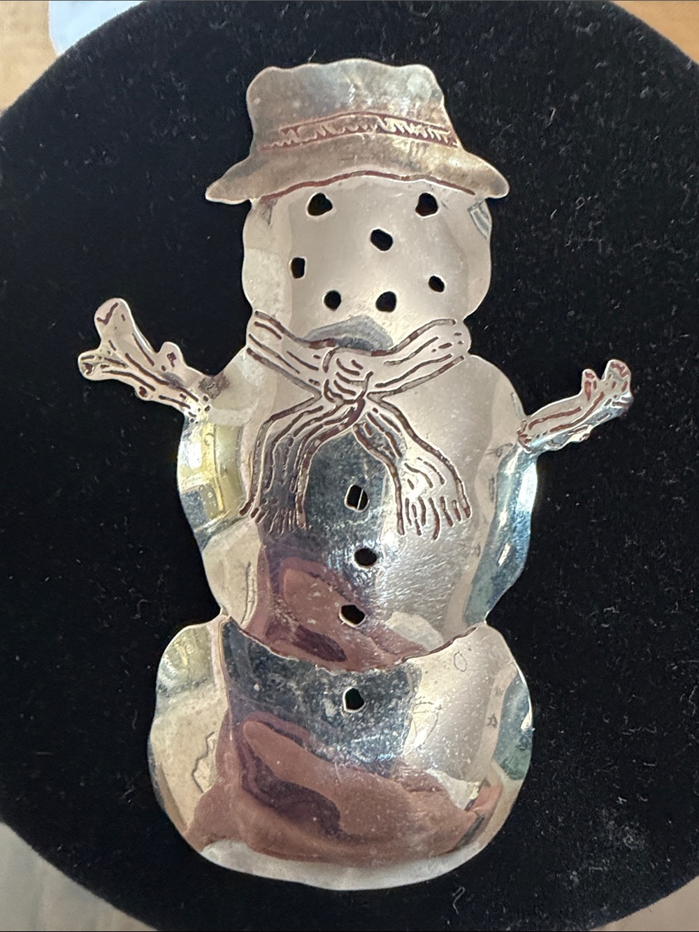 Snowman pin by Zircus. Silver and copper